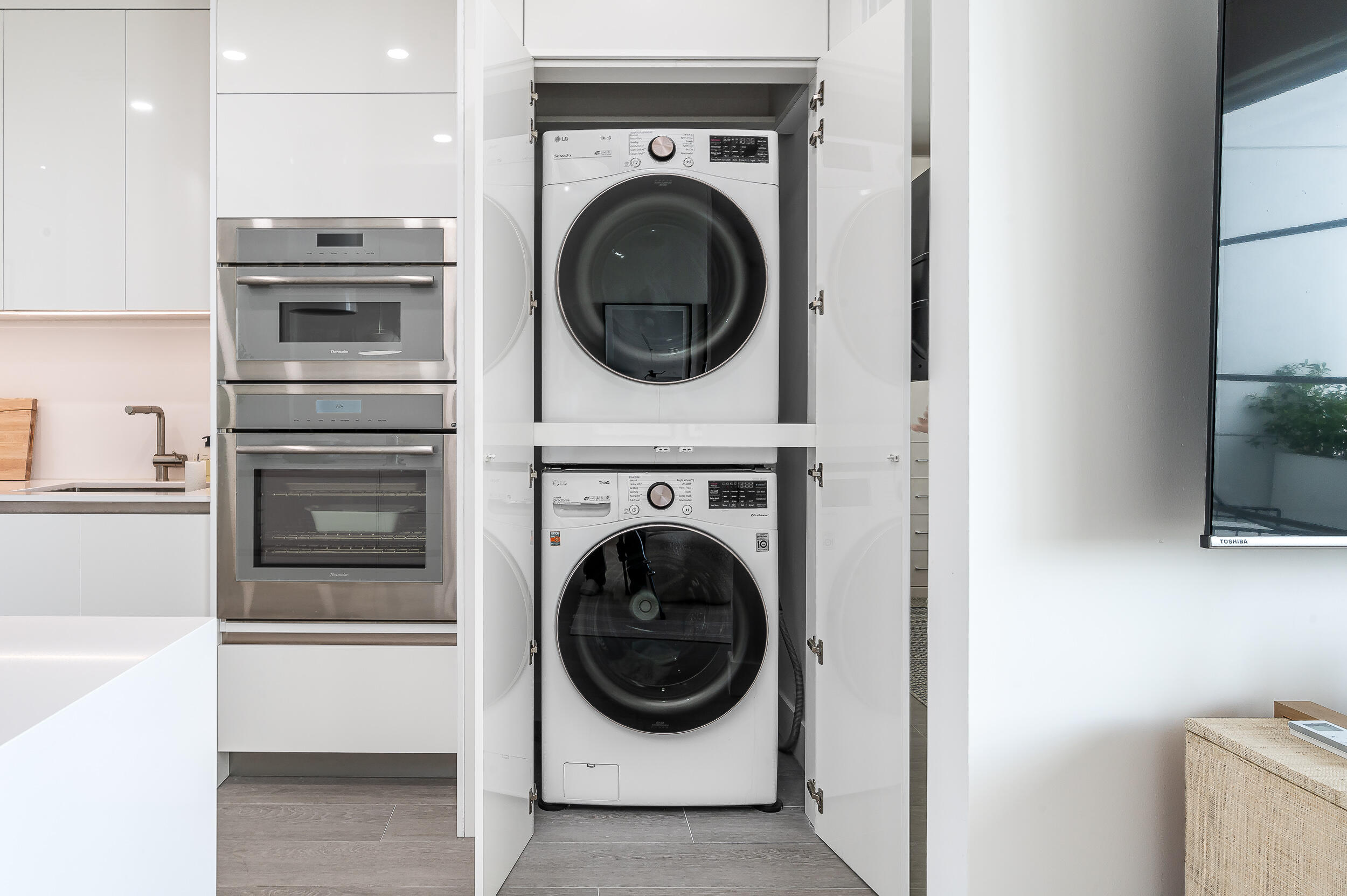 155 East Boca Raton Road, Unit 1008 Boca Raton, FL 33432 - Photo 14 of 42 a utility room with washer and dryer