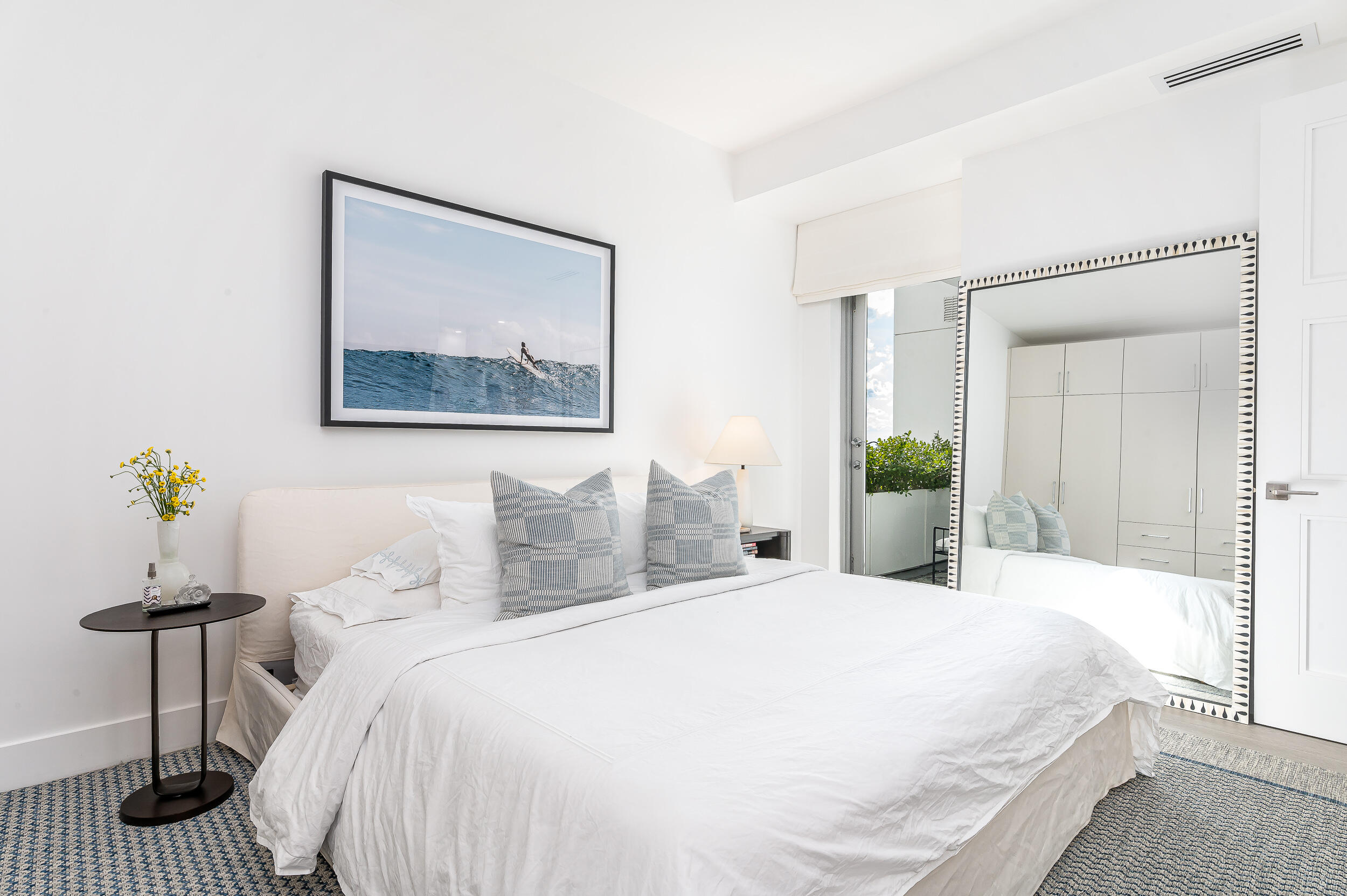 155 East Boca Raton Road, Unit 1008 Boca Raton, FL 33432 - Photo 9 of 42 a bedroom with a bed and a painting on the wall