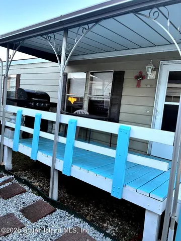 a view of a hallway with seating space