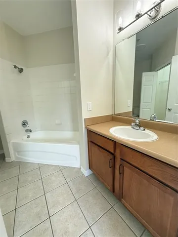a bathroom with a sink and a bathtub