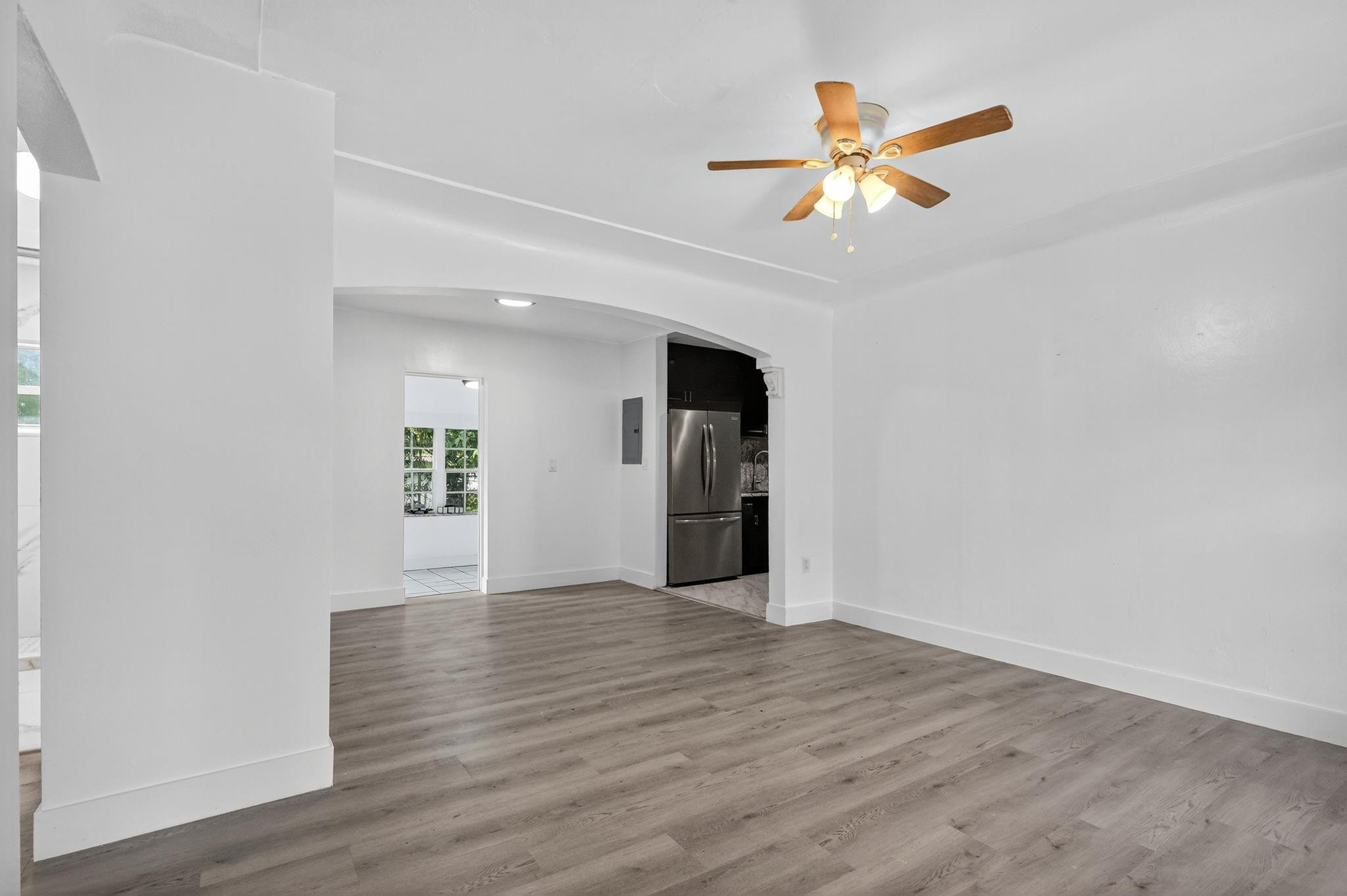 40 Northwest 68th Street Miami, FL 33150 - Photo 19 of 27 a view of an empty room with wooden floor and a window