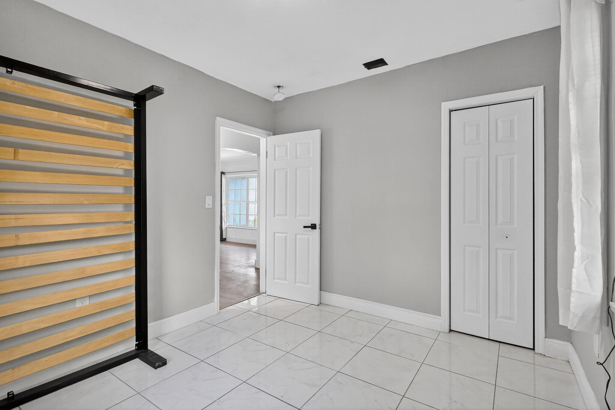 40 Northwest 68th Street Miami, FL 33150 - Photo 20 of 27 a view of an empty room and window