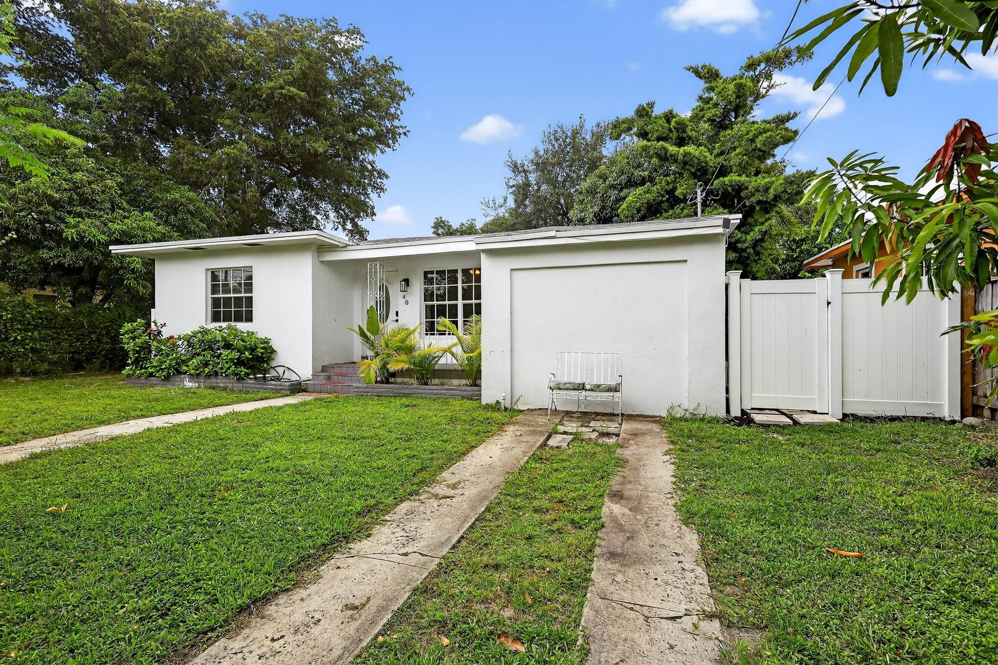 40 Northwest 68th Street Miami, FL 33150 - Photo 2 of 27 a front view of house with yard