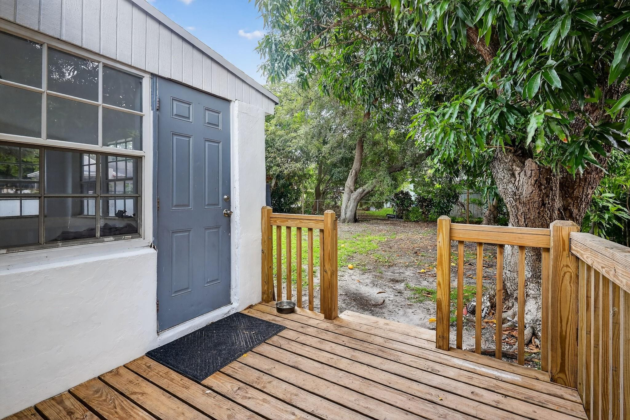 40 Northwest 68th Street Miami, FL 33150 - Photo 23 of 27 a view of balcony with wooden floor and fence