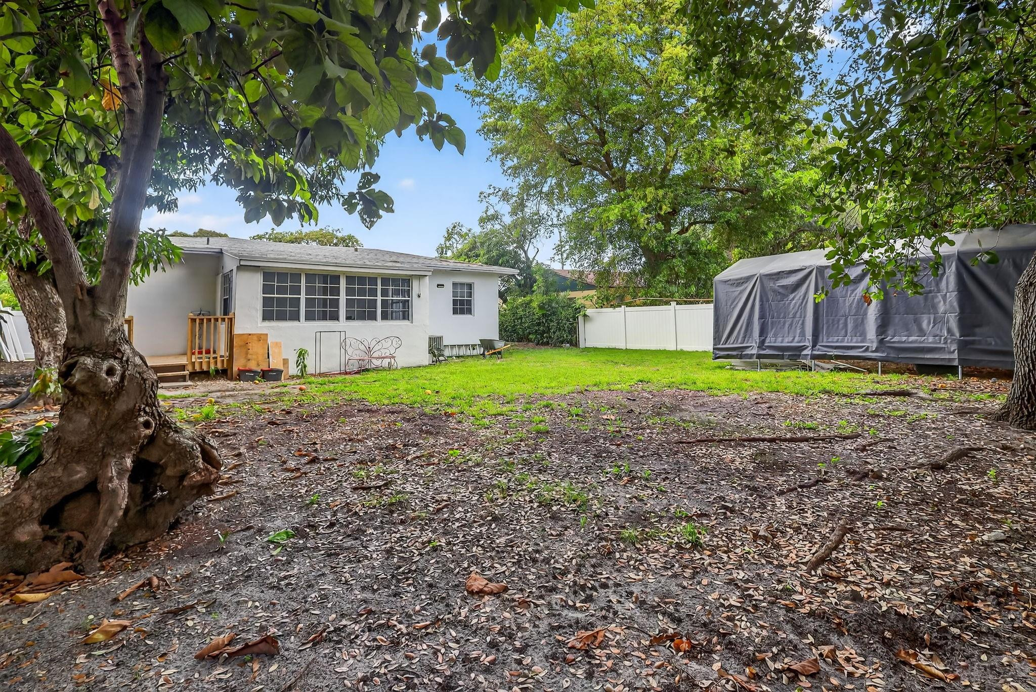 40 Northwest 68th Street Miami, FL 33150 - Photo 24 of 27 a house with swimming pool in front of it