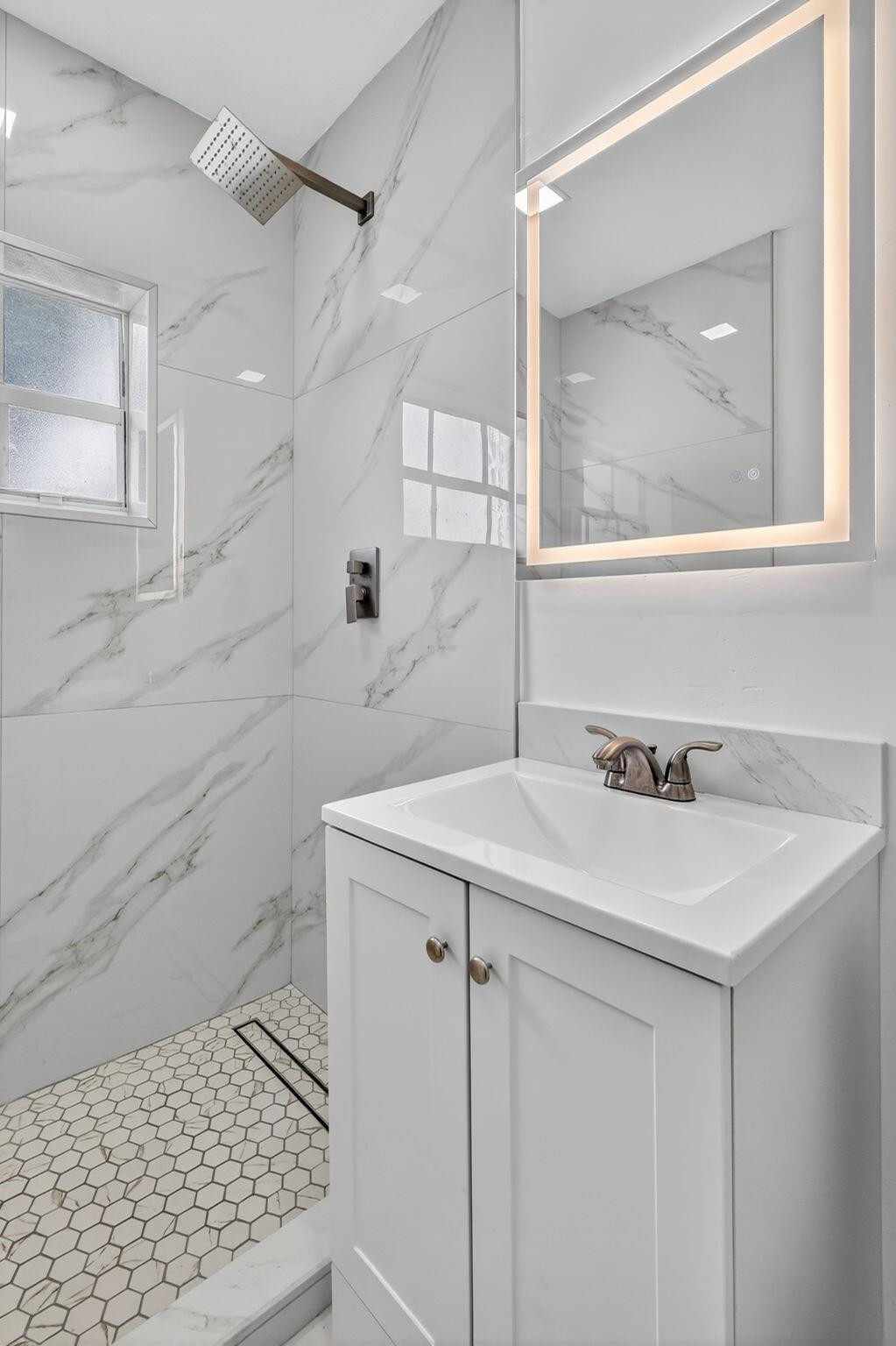 40 Northwest 68th Street Miami, FL 33150 - Photo 6 of 27 a bathroom with a sink a toilet and mirror