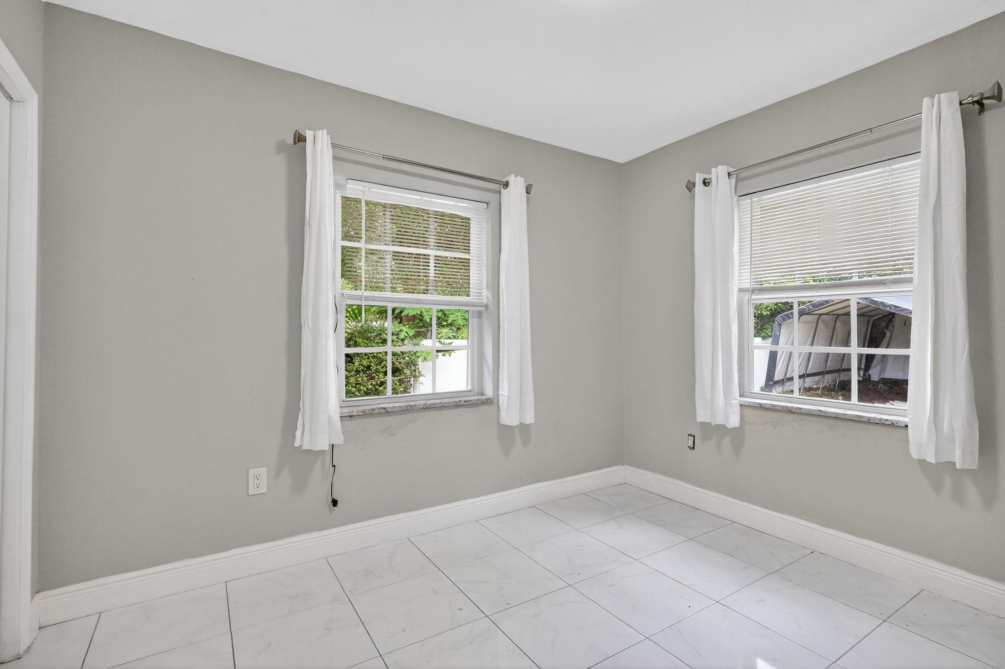 40 Northwest 68th Street Miami, FL 33150 - Photo 9 of 27 a view of an empty room with a window