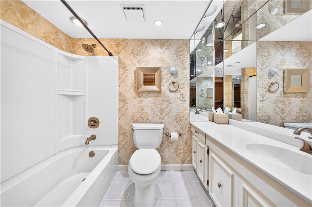 302 Fox Chapel Road, Unit 307 Pittsburgh, PA 15238 - Photo 17 of 33 The 12' × 8' primary bathroom features a tub and ceramic tile flooring.
