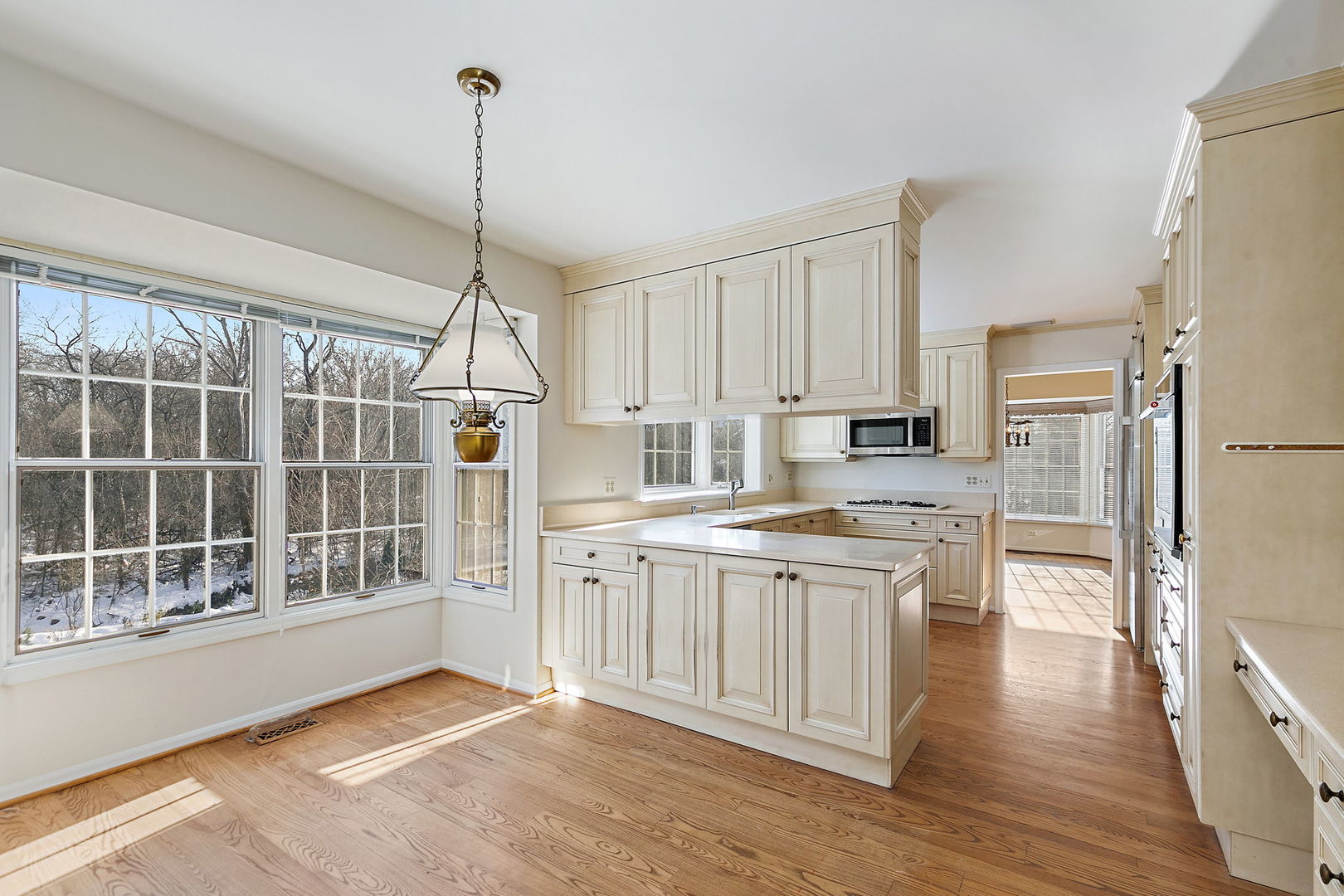 43 North Ravenscraig Lane Inverness, IL 60067 - Photo 12 of 64 a kitchen with stainless steel appliances granite countertop a refrigerator a sink dishwasher a stove with white cabinets and wooden floor