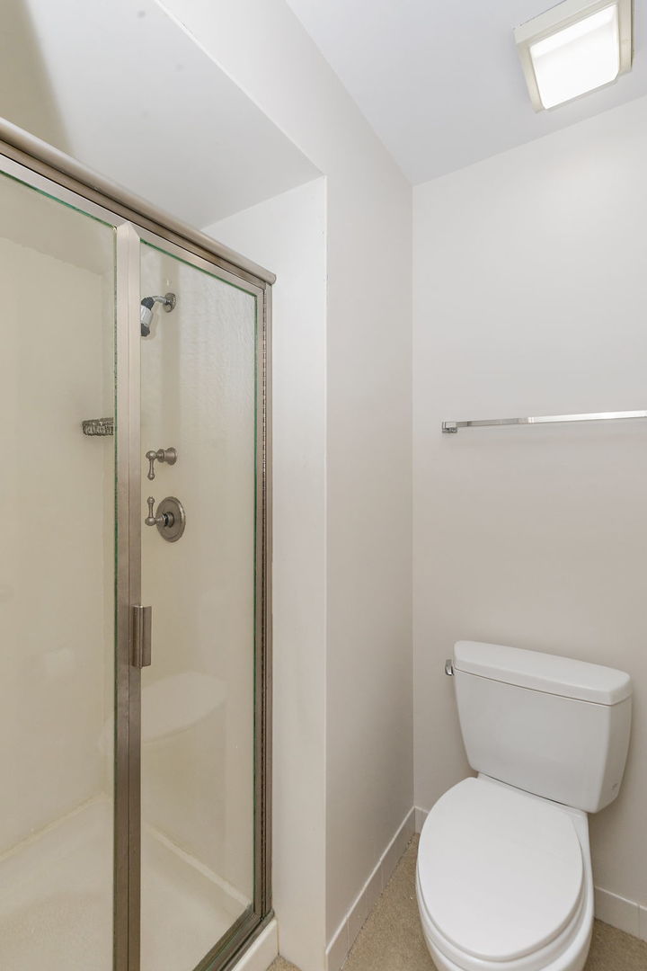 43 North Ravenscraig Lane Inverness, IL 60067 - Photo 18 of 64 a white toilet sitting next to a bathroom sink