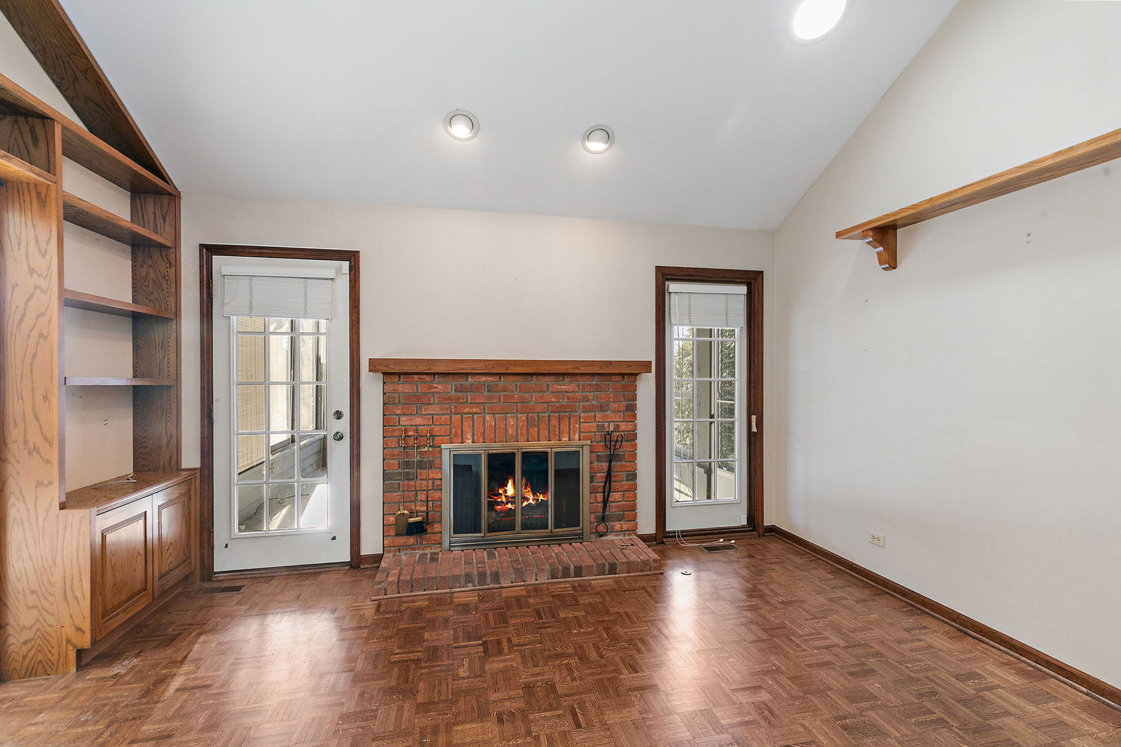 43 North Ravenscraig Lane Inverness, IL 60067 - Photo 20 of 64 an empty room with wooden floor fireplace and windows