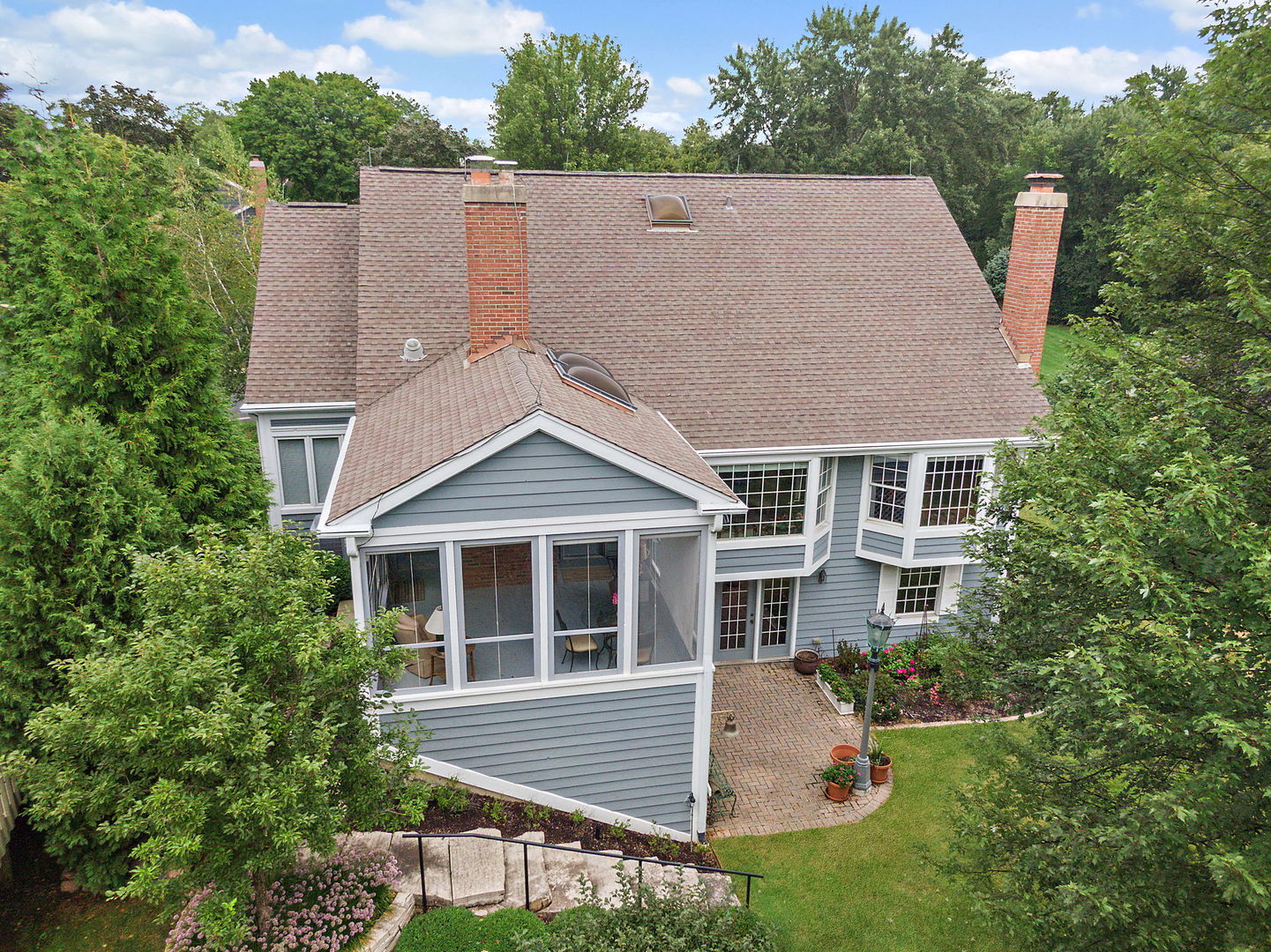 43 North Ravenscraig Lane Inverness, IL 60067 - Photo 55 of 64 a aerial view of a house with yard and trees in the background