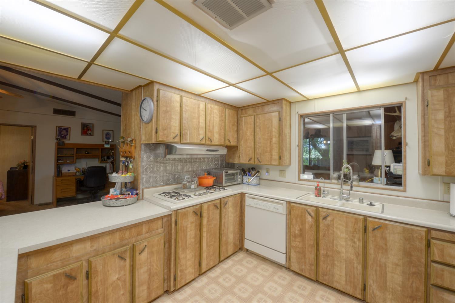 1471 Highway 33 Gustine, CA 95322 - Photo 50 of 57 a kitchen with a sink cabinets and window