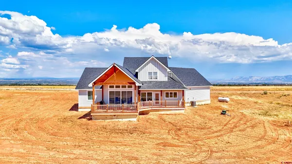 a front view of house with yard and seating space