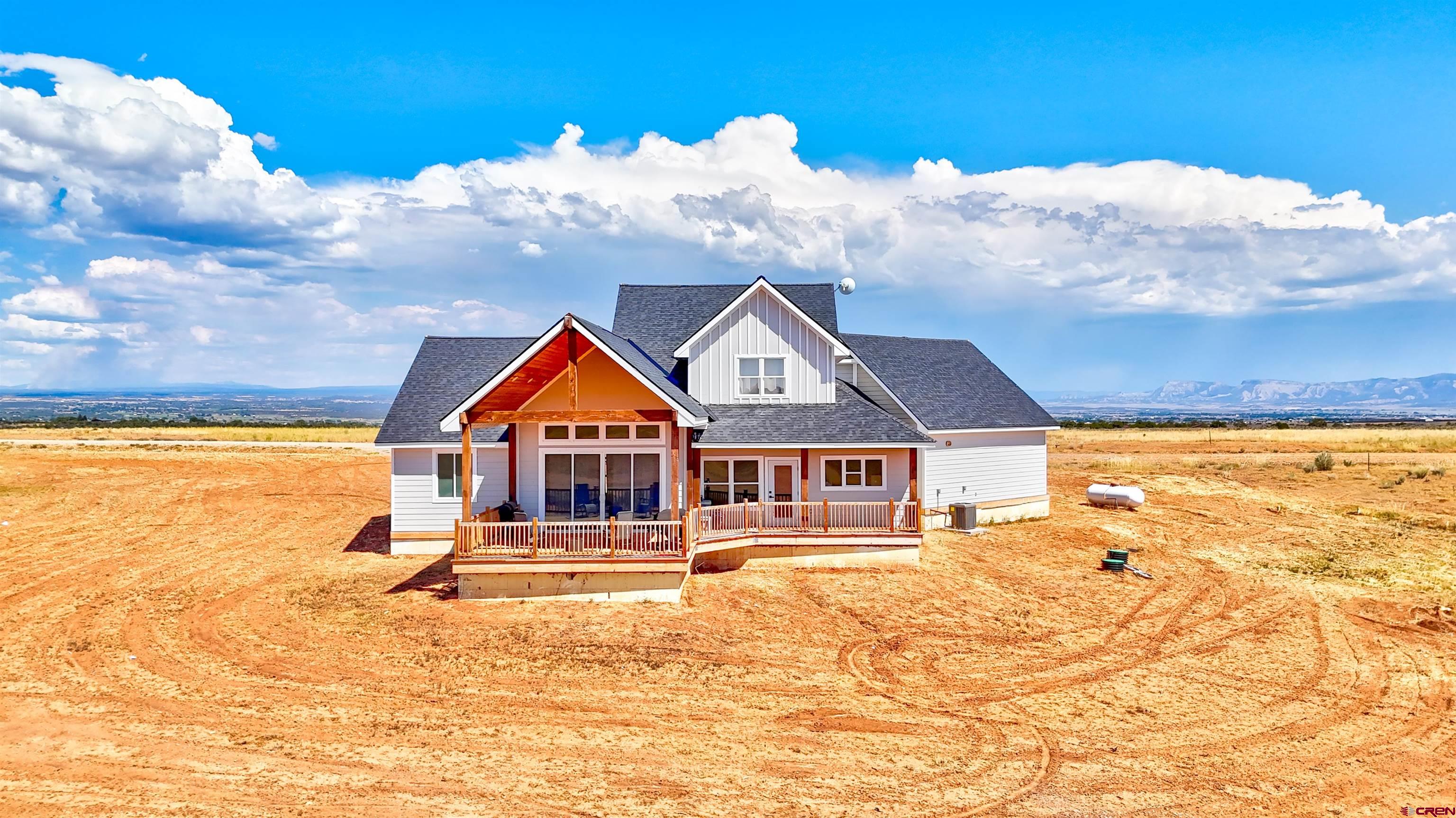 13205 Road 17.9 Loop Cortez, CO 81321 - Photo 4 of 35 a front view of house with yard and seating space
