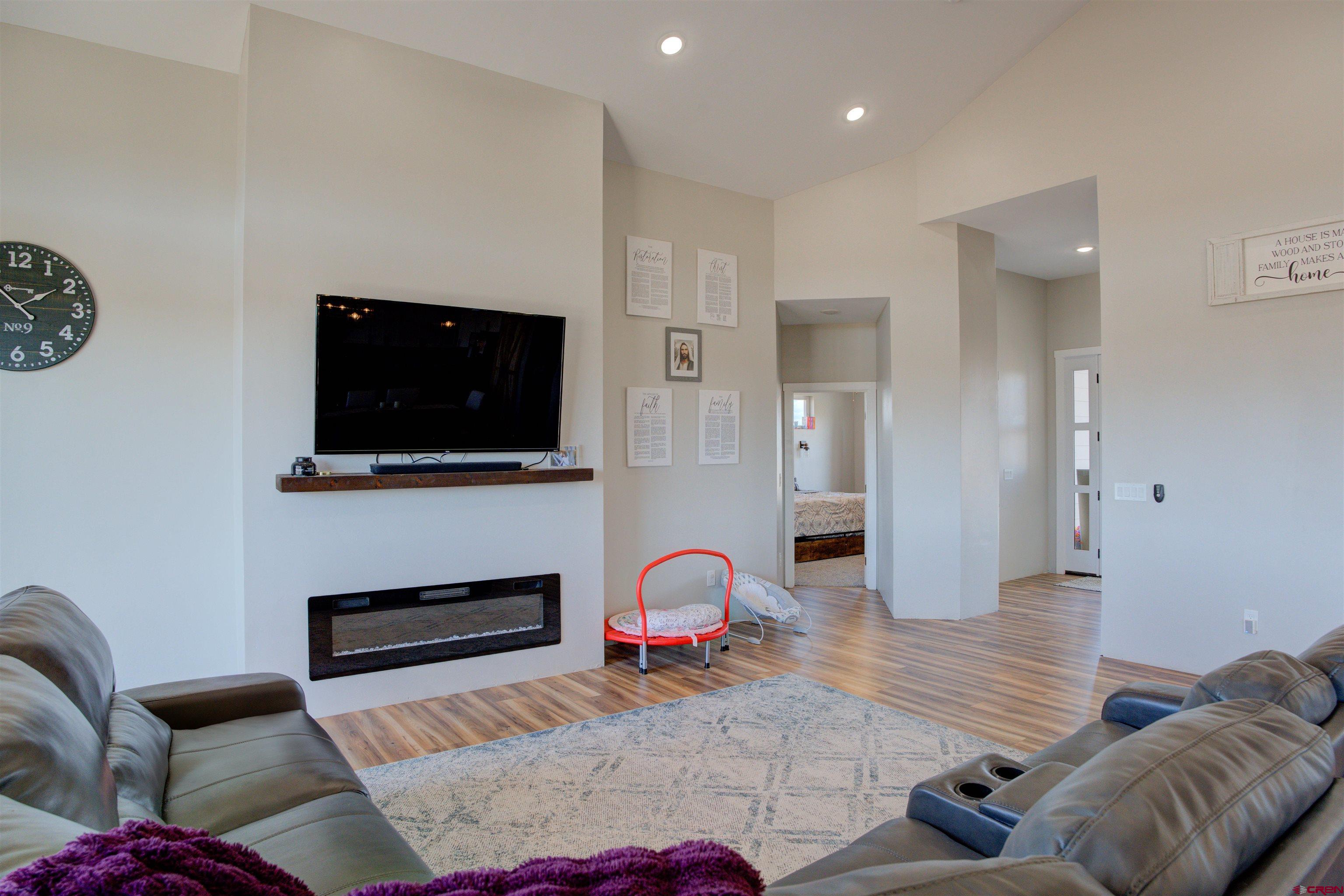 13205 Road 17.9 Loop Cortez, CO 81321 - Photo 10 of 35 a living room with furniture and a flat screen tv
