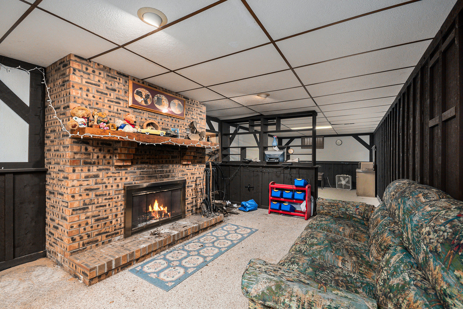 13090 River Road Plano, IL 60545 - Photo 14 of 27 a living room with furniture a fireplace and a flat screen tv
