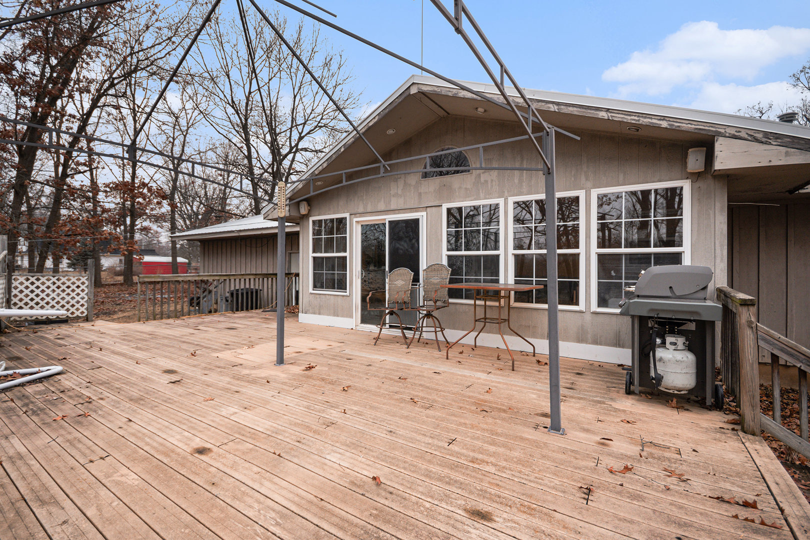13090 River Road Plano, IL 60545 - Photo 19 of 27 a view of a dinning table and chairs in the patio of the house