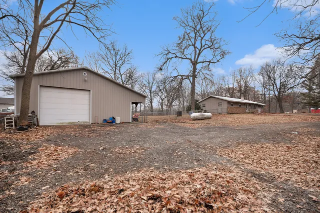a backyard of a house with large trees