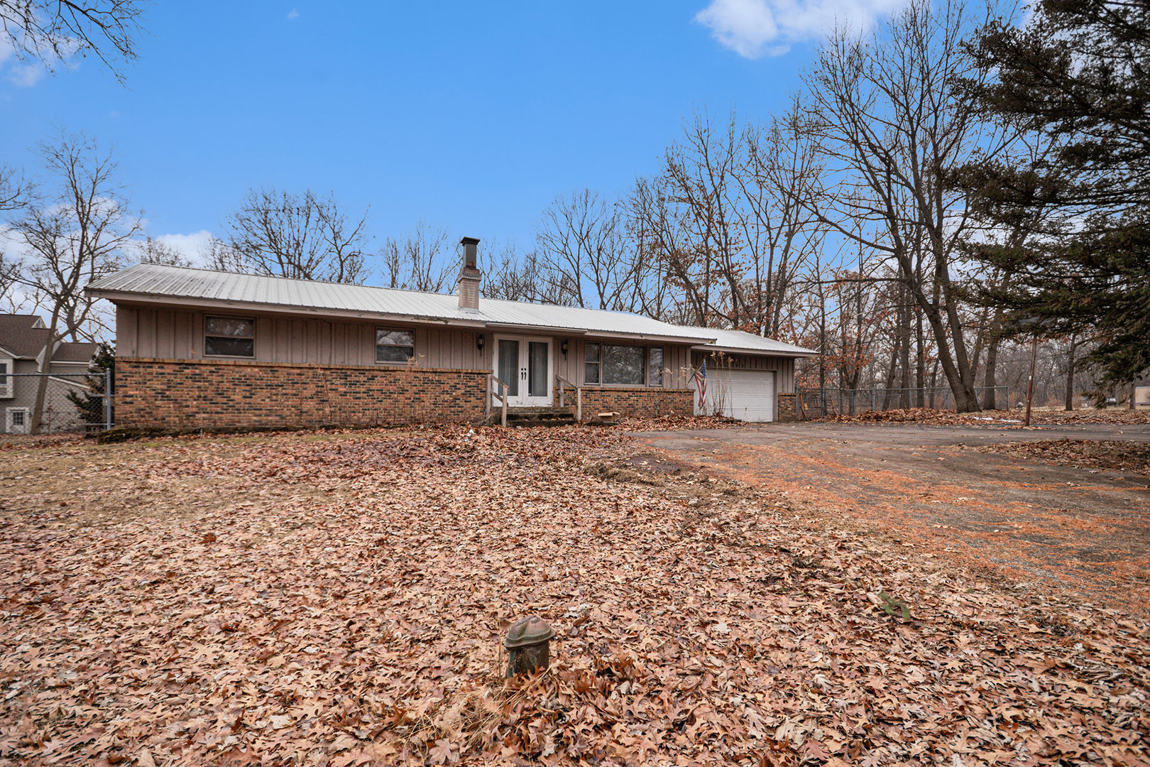 13090 River Road Plano, IL 60545 - Photo 2 of 27 a front view of a house with a yard