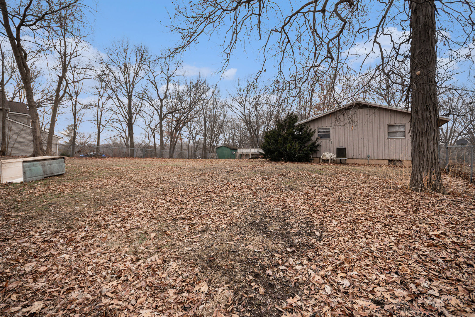 13090 River Road Plano, IL 60545 - Photo 21 of 27 a backyard of a house with large trees