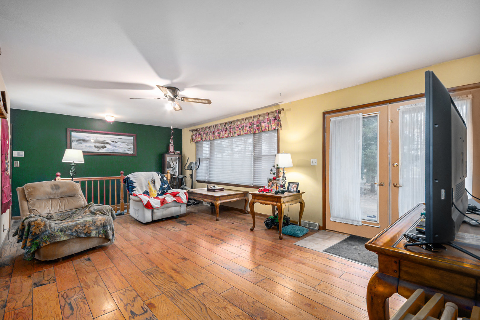 13090 River Road Plano, IL 60545 - Photo 4 of 27 a living room with furniture and a flat screen tv