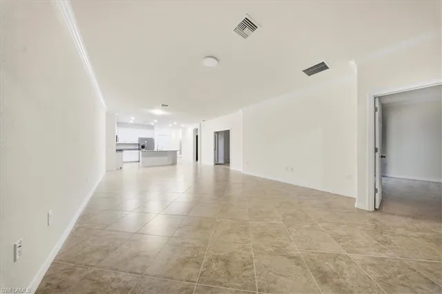 a view of a hallway with a kitchen
