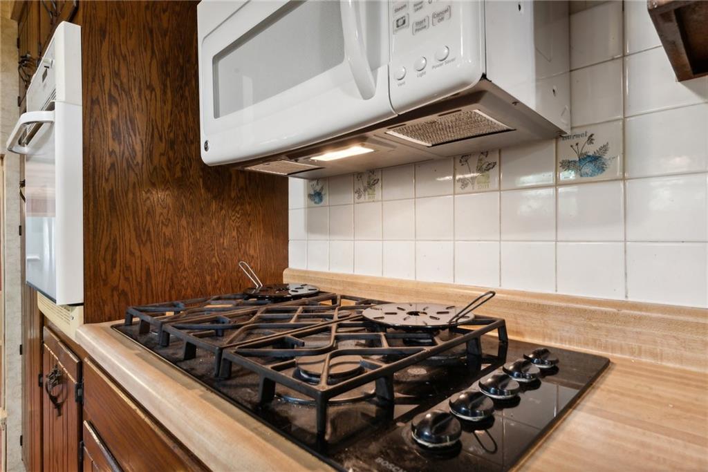 2213 Hall Drive Export, PA 15632 - Photo 13 of 36 a stove top oven sitting inside of a kitchen