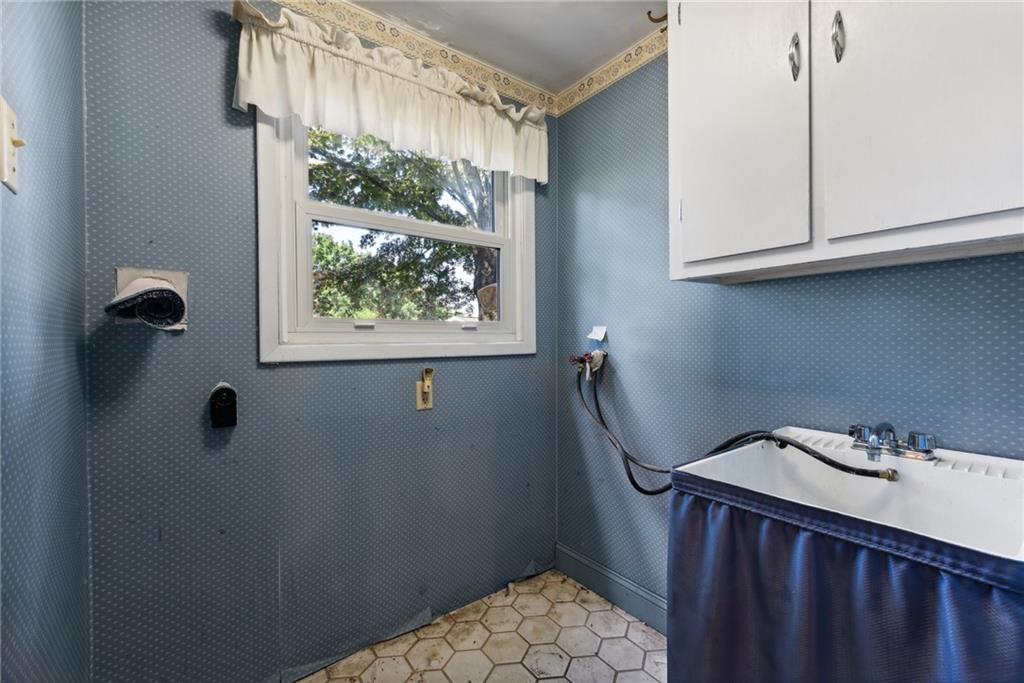 2213 Hall Drive Export, PA 15632 - Photo 17 of 36 a bathroom with a sink a toilet and a window