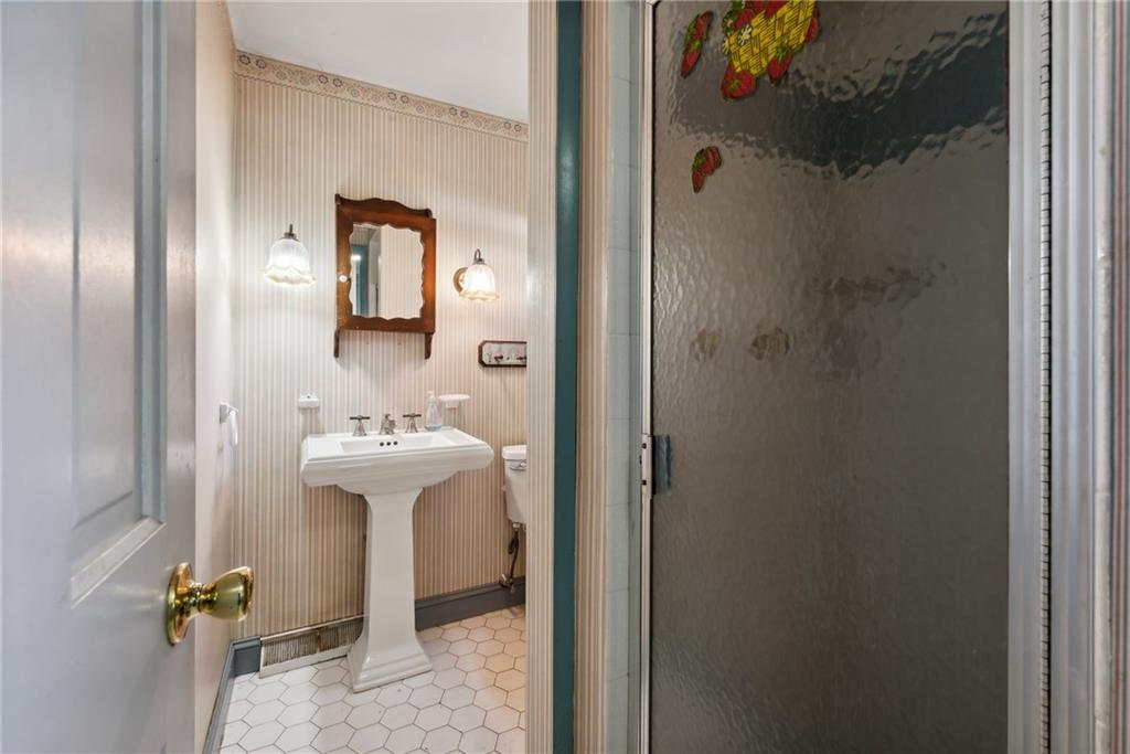 2213 Hall Drive Export, PA 15632 - Photo 18 of 36 a bathroom with a sink and mirror