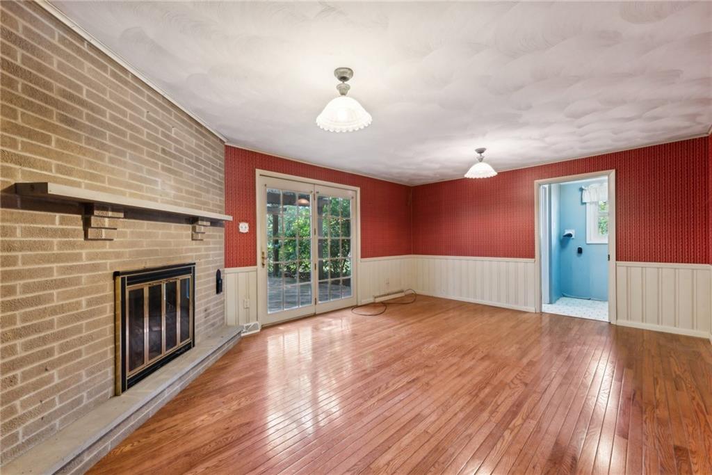 2213 Hall Drive Export, PA 15632 - Photo 2 of 36 a view of empty room with wooden floor and fireplace