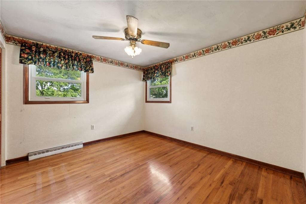 2213 Hall Drive Export, PA 15632 - Photo 22 of 36 a view of an empty room with wooden floor and a window
