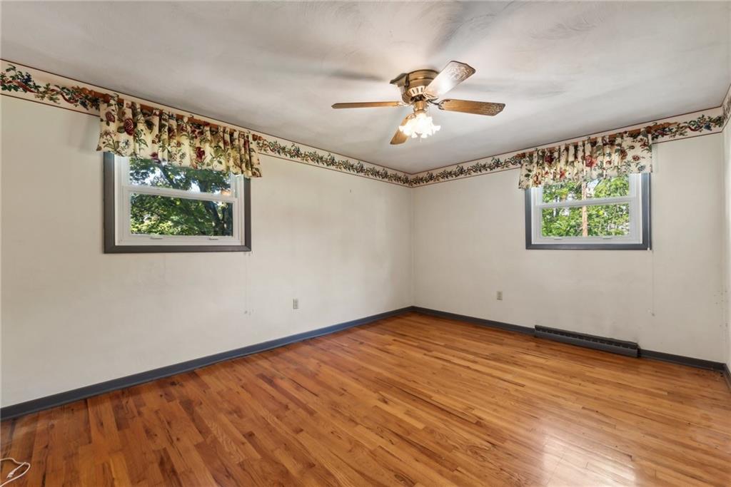 2213 Hall Drive Export, PA 15632 - Photo 24 of 36 a view of an empty room with wooden floor and a window