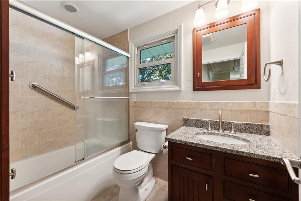 2213 Hall Drive Export, PA 15632 - Photo 26 of 36 a bathroom with a granite countertop sink toilet and a mirror
