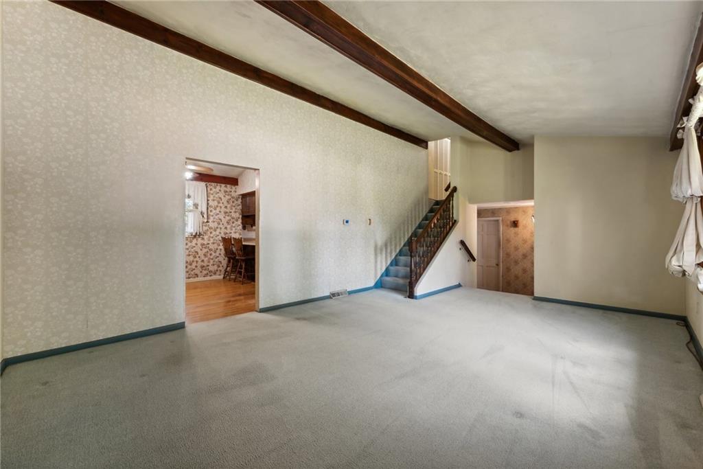 2213 Hall Drive Export, PA 15632 - Photo 6 of 36 an empty room with furniture and stairs