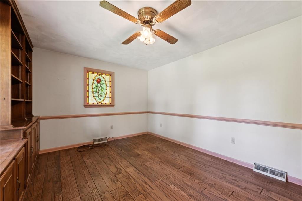 2213 Hall Drive Export, PA 15632 - Photo 8 of 36 wooden floor in an empty room with a window