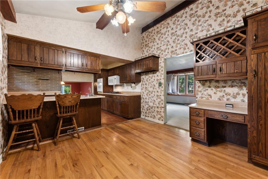 2213 Hall Drive Export, PA 15632 - Photo 10 of 36 a open kitchen with stainless steel appliances granite countertop a stove and a wooden floors