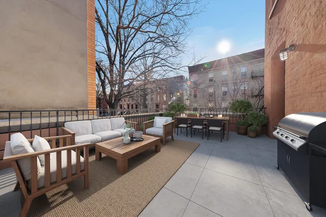 a living room with furniture and a dining table