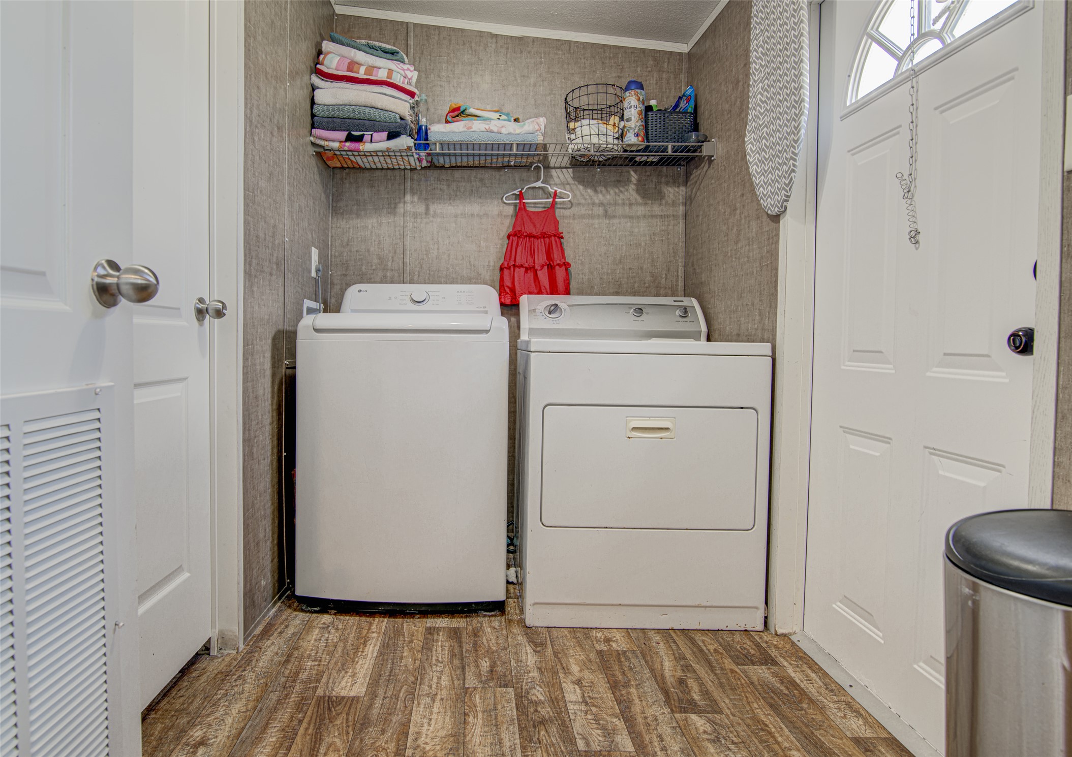 445 Rancho Linda Drive Lockhart, TX 78644 - Photo 25 of 26 Functional utility space with washer and dryer for household chores.