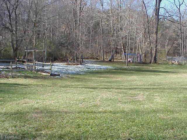 209 Whispering Creek Road King, NC 27021 - Photo 4 of 9 Other. Beautiful level back yard.
