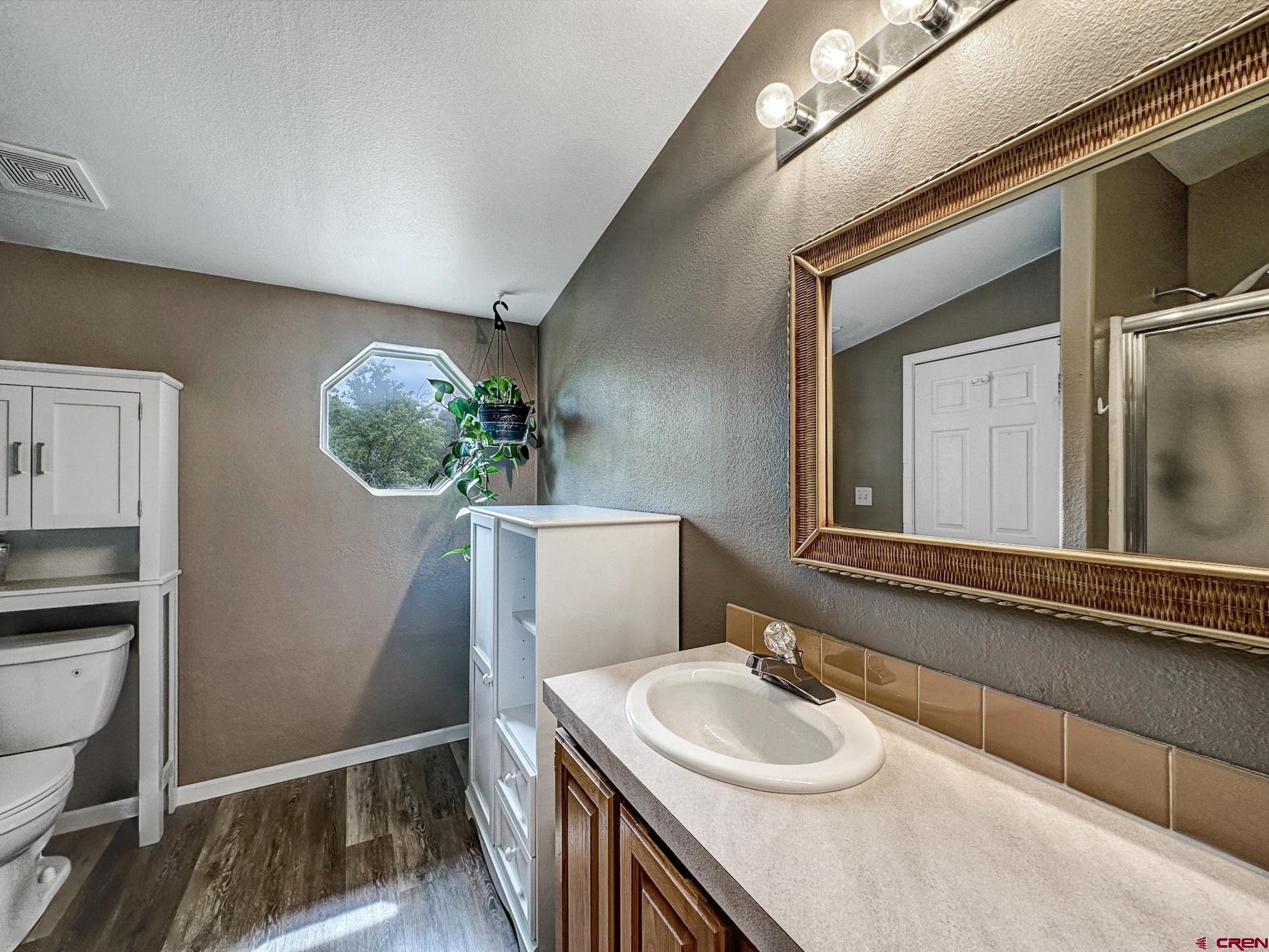 29501 P50 Road Hotchkiss, CO 81419 - Photo 20 of 45 a bathroom with a sink and a mirror
