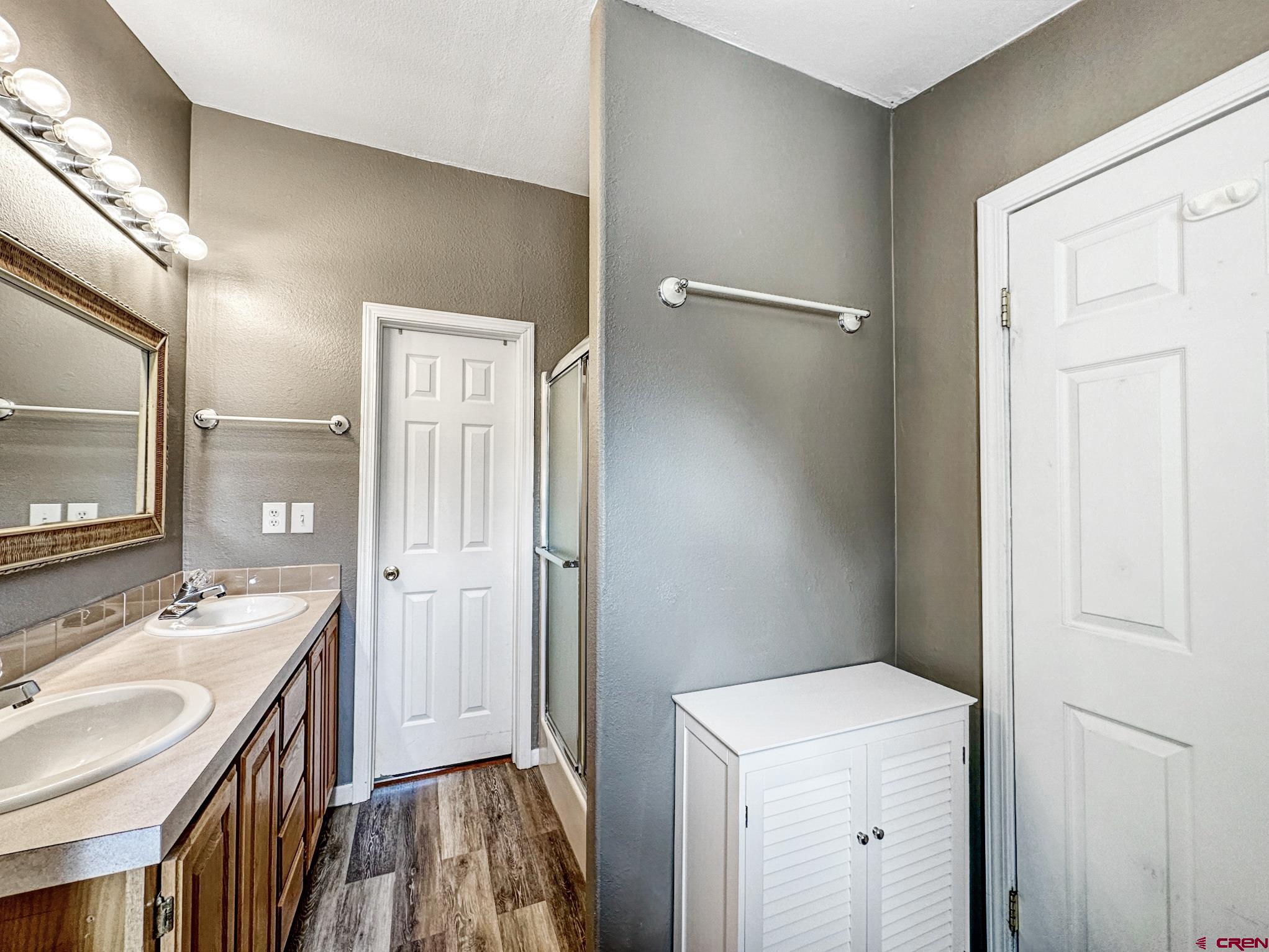 29501 P50 Road Hotchkiss, CO 81419 - Photo 21 of 45 a bathroom with a sink a mirror and a shower