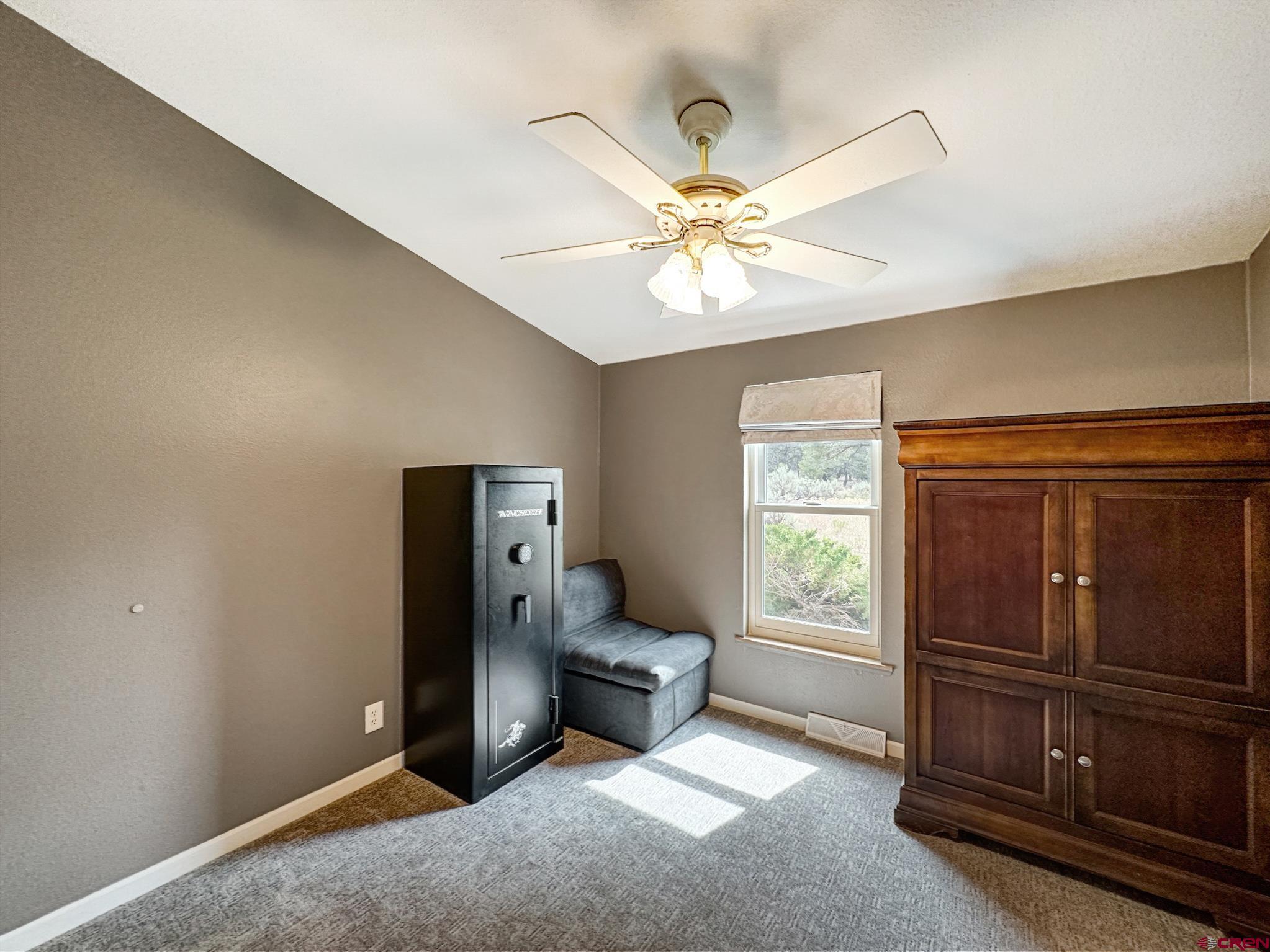 29501 P50 Road Hotchkiss, CO 81419 - Photo 24 of 45 a living room with furniture and a window