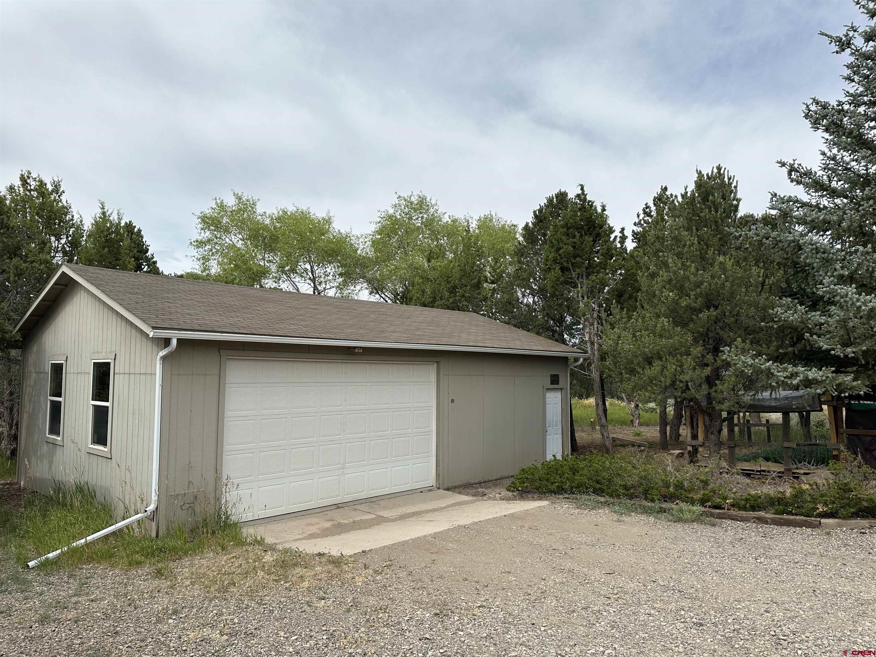 29501 P50 Road Hotchkiss, CO 81419 - Photo 30 of 45 a house with trees in the background