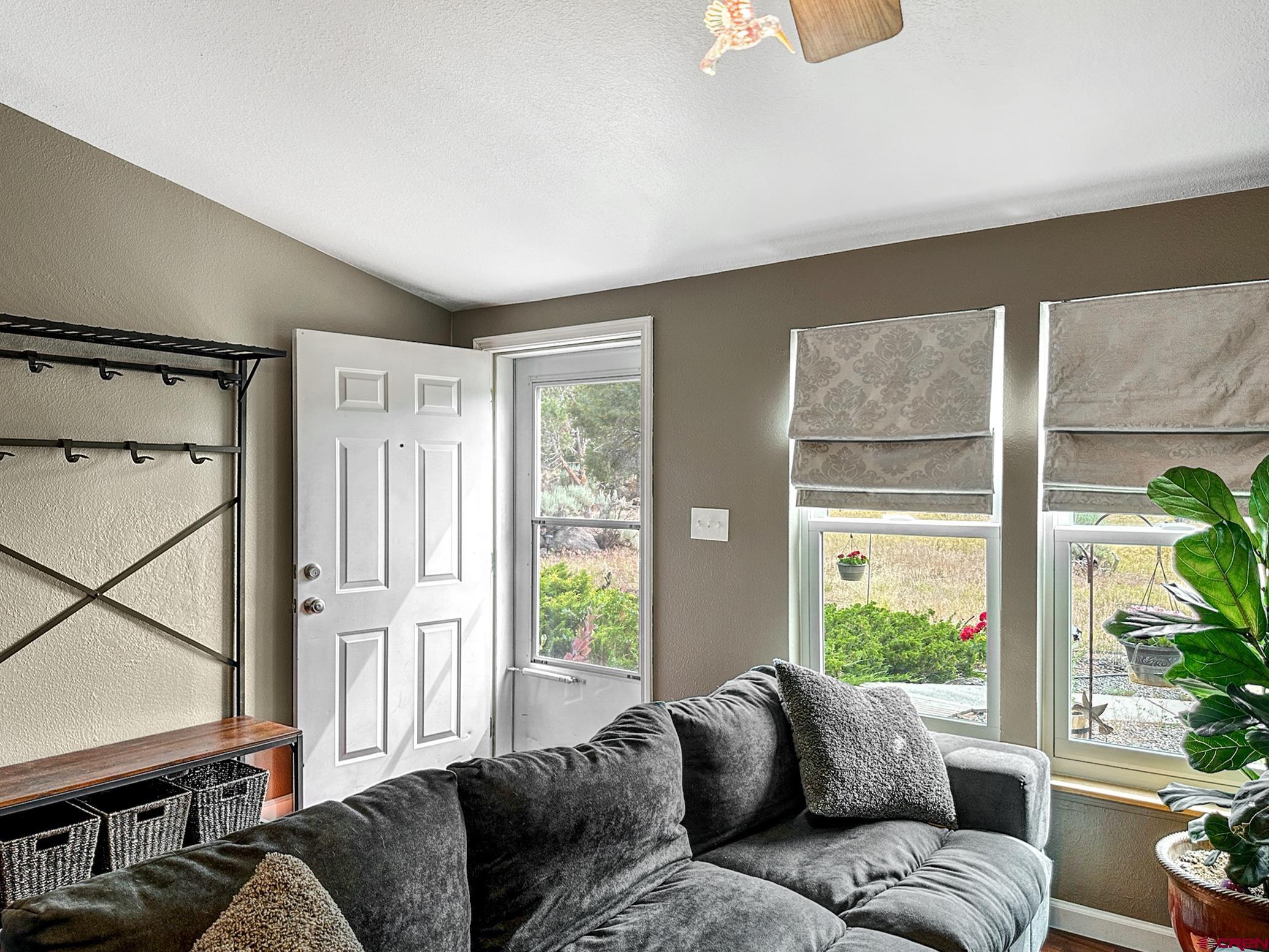 29501 P50 Road Hotchkiss, CO 81419 - Photo 9 of 45 a living room with furniture and a window