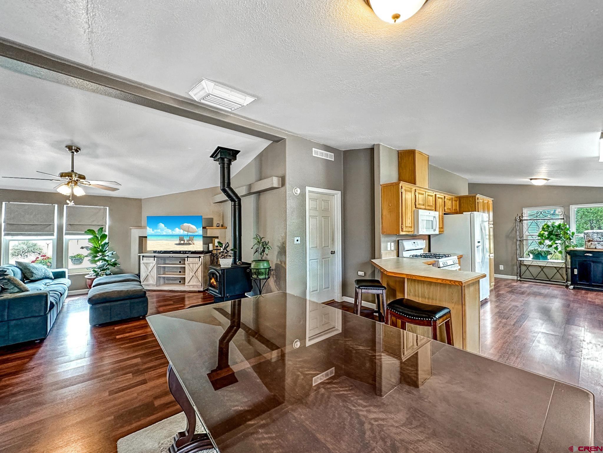 29501 P50 Road Hotchkiss, CO 81419 - Photo 10 of 45 a living room with fireplace furniture and a large window