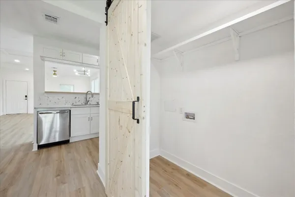 a bathroom with a granite countertop sink a toilet and shower