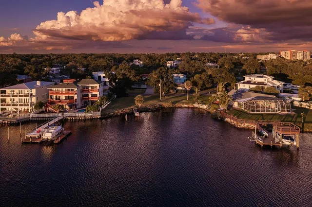 an aerial view of a house with outdoor space