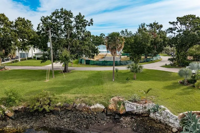 a view of a town with large trees