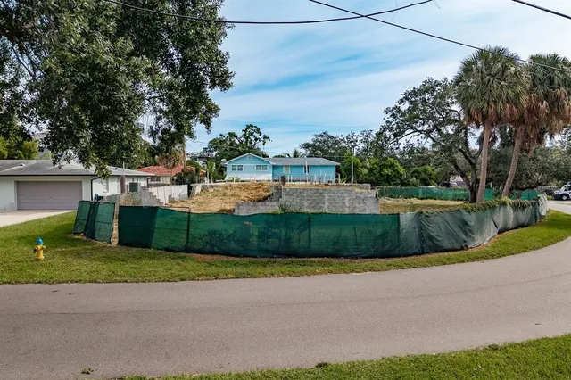 a view of a garden with lawn chairs
